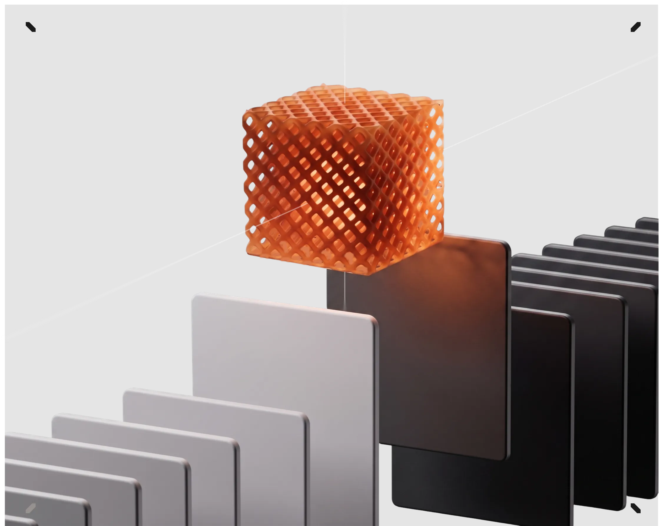 Orange lattice cube resting on a row of light and dark material sample plates