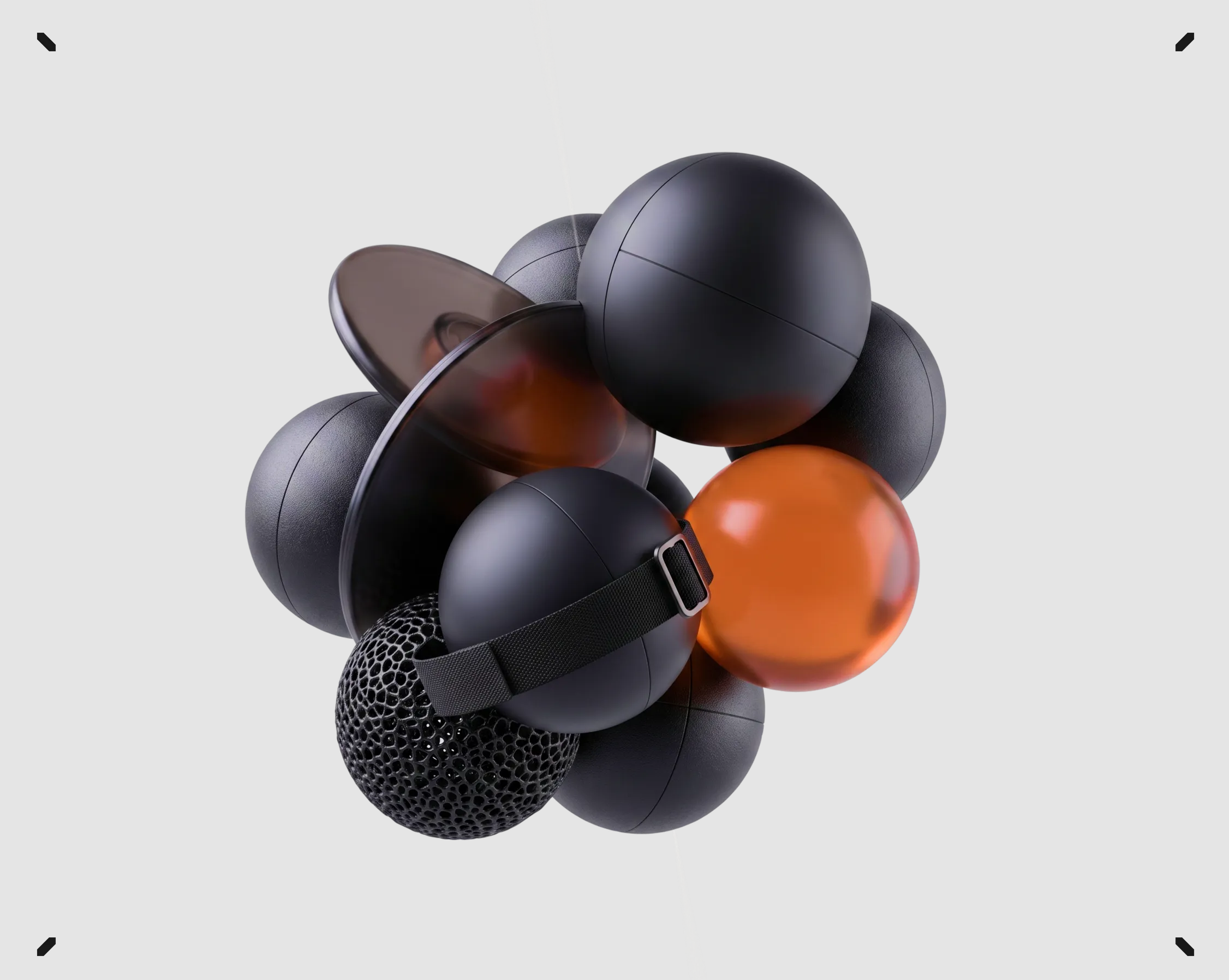 Cluster of matte black, perforated, and translucent orange material sample spheres